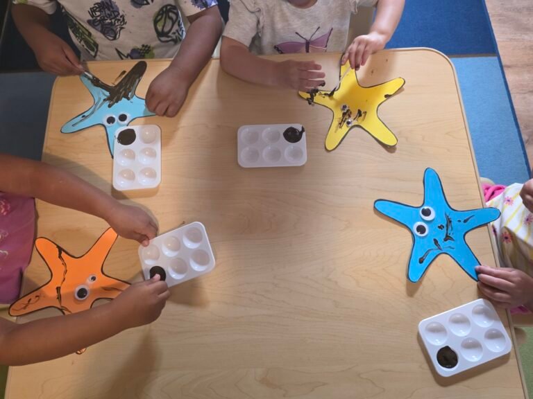 Image of children finger painting.