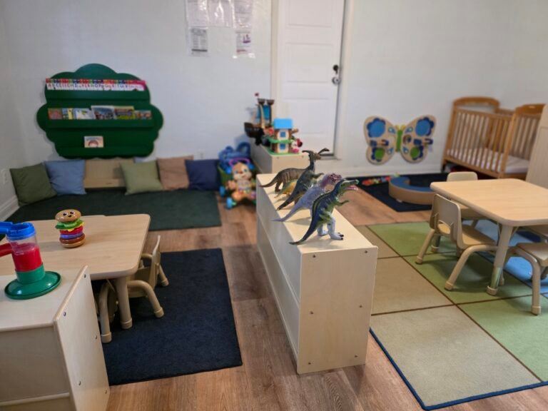 Image of a room with tables and dinosaur toys.