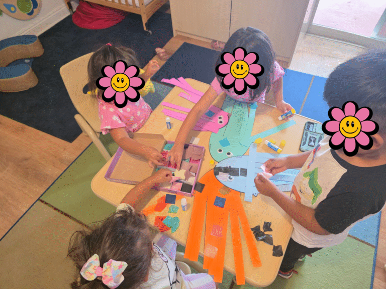 Children doing arts and crafts inside daycare.